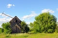 Ruins of an old mill in the green grass Royalty Free Stock Photo