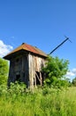 Ruins of an old mill in the green grass Royalty Free Stock Photo
