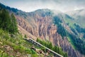 Ruins of old mountain road in dolomite Alps. Impressive morning scene in Italy. Misty summer landscape ot the high mountains. Royalty Free Stock Photo