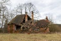 Ruins of an old red brick single family house. Demolished country house