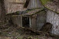 Ruins of an old wooden abandoned house in the autumn. barn in Pripyat city in Chernobyl Exclusion Zone Royalty Free Stock Photo