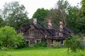 Ruins of old, wooden burned down house. Building without roof. Royalty Free Stock Photo