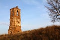 Ruins of Orthodox old church of red brick and wood against the backdrop of the landscape and the blue sky in the morning Royalty Free Stock Photo