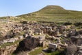 The ruins of the outer part of the palace of King Herod, against the background of the filled artificial hill in which they are