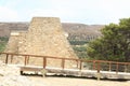 Ruins of palace Knossos behind pedestrian bridge