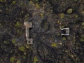 Ruins at Paricutin Volcano situated on a rocky landscape surrounded by lush greenery