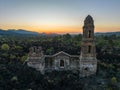 Ruins at Paricutin Volcano situated on a rocky landscape surrounded by lush greenery