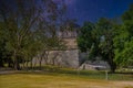 Ruins of red house in Chichen Itza, Yucatan, Mexico, Maya civilization with Milky Way Galaxy stars night sky Royalty Free Stock Photo