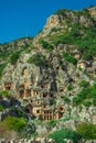 Ruins of Rock-cut tombs in ancient Lycian city of Myra. Lycian way, Demre, Antalya province, Turkey. Royalty Free Stock Photo