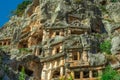 Ruins of Rock-cut tombs in ancient Lycian city of Myra. Lycian way, Demre, Antalya province, Turkey. Royalty Free Stock Photo