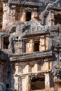 Ruins of a rocky necropolis with tombs carved in stone in Myra Lycian Royalty Free Stock Photo