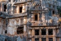 Ruins of a rocky necropolis with tombs carved in stone in Myra Lycian Royalty Free Stock Photo