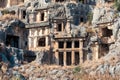 Ruins of a rocky necropolis with tombs carved in stone in Myra Lycian Royalty Free Stock Photo