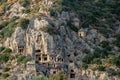 Ruins of a rocky necropolis with tombs carved in stone in Myra Lycian Royalty Free Stock Photo