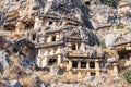 Ruins of a rocky necropolis with stone-cut tombs in Myra Lycian now Demre, Turkey Royalty Free Stock Photo