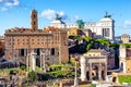 Ruins of the Roman Forum with the Capitolium and National Monument to Victor Emmanuel II in the background in Rome, Italy Royalty Free Stock Photo