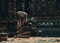 Ruins of Seated Buddha figure and a part of Naga at Ayutthaya Historical park, Thailand.