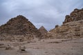 Ruins of the small pyramid of Queen Henutsen with Khafre Pyramids at background, Giza Plateau, Egypt. UNESCO World Heritage Royalty Free Stock Photo