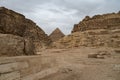 Ruins of the small pyramid of Queen Henutsen with Khafre Pyramids at background, Giza Plateau, Egypt. UNESCO World Heritage Royalty Free Stock Photo