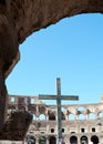 Ruins and stone cross inside the Roman Colosseum Royalty Free Stock Photo