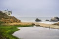 Ruins of the Sutro baths on a cloudy day; the Cliff house in the background, Lands End, San Francisco, California Royalty Free Stock Photo