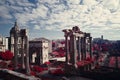 Ruins of the Temple of Caesar against the cloudy blue sky.  Rome, Italy. Royalty Free Stock Photo