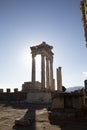 Ruins of the Temple of Trajan the ancient site of Pergamon. Izmir, Turkey. Ancient city columns with the sun in the background. Royalty Free Stock Photo