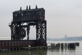 Ruins of the 69th Street Transfer Bridge in the Hudson River of New York City on a Foggy Day