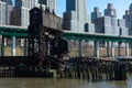 Ruins of the 69th Street Transfer Bridge in the Hudson River with Skyscrapers in background in the Lincoln Square New York City Sk