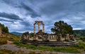 Ruins of Tholos of ancient Greek goddess Athena Pronaia in Delphi, Greece. Circle of parts and restored Doric columns Royalty Free Stock Photo