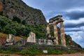 Ruins of Tholos of ancient Greek goddess Athena Pronaia in Delphi, Greece. Restored three Doric columns. UNESCO World Royalty Free Stock Photo