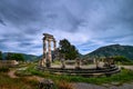 Ruins of Tholos of ancient Greek goddess Athena Pronaia in Delphi, Greece. Parts and restored Doric columns. UNESCO Royalty Free Stock Photo