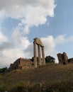 Ruins of the three Corinthian columns, remains of ancient Temple of Castor and Pollux at Roman Forum, Rome, Italy