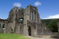 Ruins of walls and arches of old abbey in Brecon Beacons in Wales Royalty Free Stock Photo