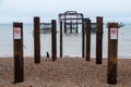 The ruins of West Pier, Brighton, East Sussex, UK, photographed at low tide on a winter`s day in December