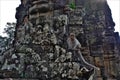 The ruins of the world famous Angkor in Cambodia. The majestic stone towers are partially destroyed by time