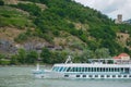 ruise ship on Danube river and mountains in background. Royalty Free Stock Photo