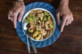 RUJAK - traditional fruit and vegetable salad dish in Indonesia with hands Royalty Free Stock Photo