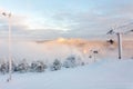 Ruka, Finland - November 28, 2012: Skiers sitting on the chair ski lift at Ruka ski resort in freezing day