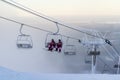 Ruka, Finland - November 27, 2012: Skiers are sitting on the chair ski lift at Ruka ski resort in freezing day