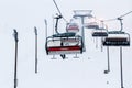 Ruka, Finland - November 24, 2012: Skiers are sitting on the chair ski lift at Ruka ski resort in freezing day