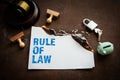 Rule of Law concept. Burning sheet of paper on a rusty metal background Royalty Free Stock Photo