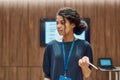 Rule the progress. Close up of young female speaker giving a talk at informal business meeting in modern workspace