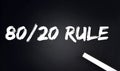 80 20 Rule Text on Black Chalkboard with a piece of chalk