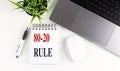 80-20 RULE text on notebook with laptop, mouse and pen