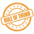 RULE OF THUMB text on orange grungy round rubber stamp