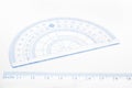 Ruler and blurred protractor Royalty Free Stock Photo