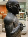 Statue of Gudea made of carved and polished mottled green dolerite at the British Museum