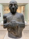 Statue of Gudea made of carved and polished mottled green dolerite at the British Museum