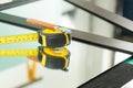 A ruler and a glass cutter, They lie on the mirror, The glass industry and the glaziers tools Royalty Free Stock Photo